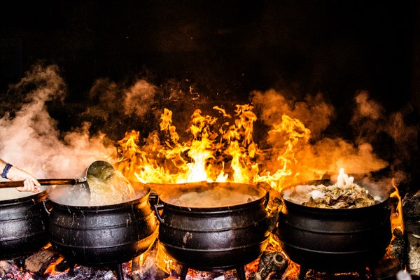 pots cooking on fire