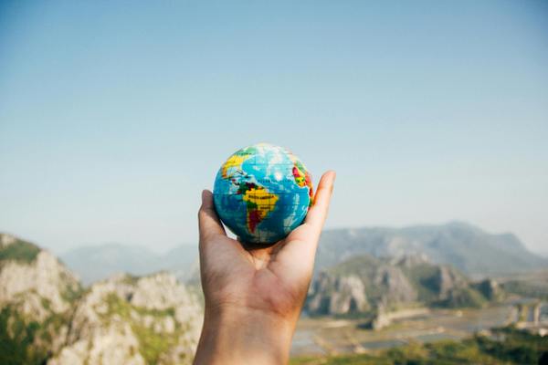 person holding a globe