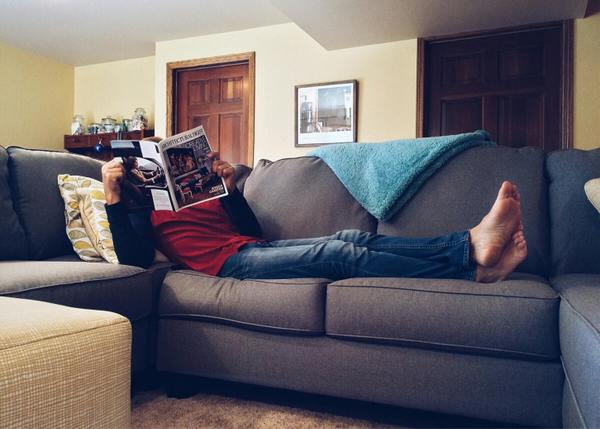 woman lying on a sofa